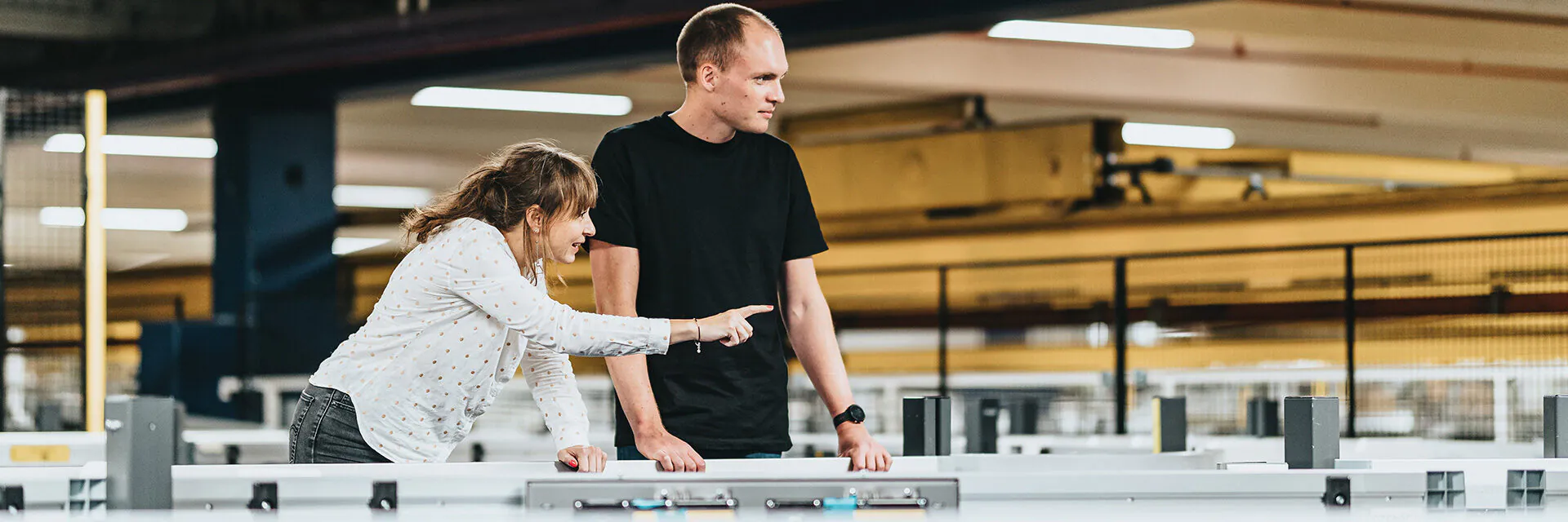 Louise Christensen, Engineering Director from Denmark shows her colleague how the system works.